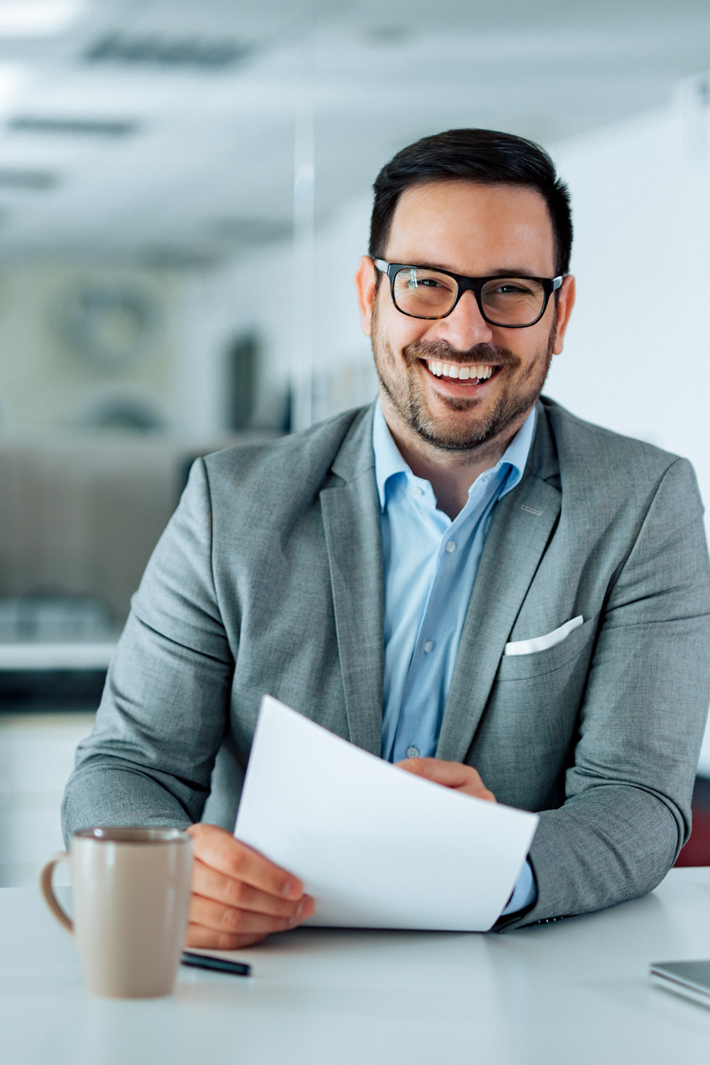 Portrait of a smiling HR leader in the office.