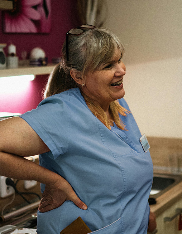 nurse-leaning-smiling-pinkscrubs-tall Excerpt of a spreadsheet showing time, date, name, and more on a report