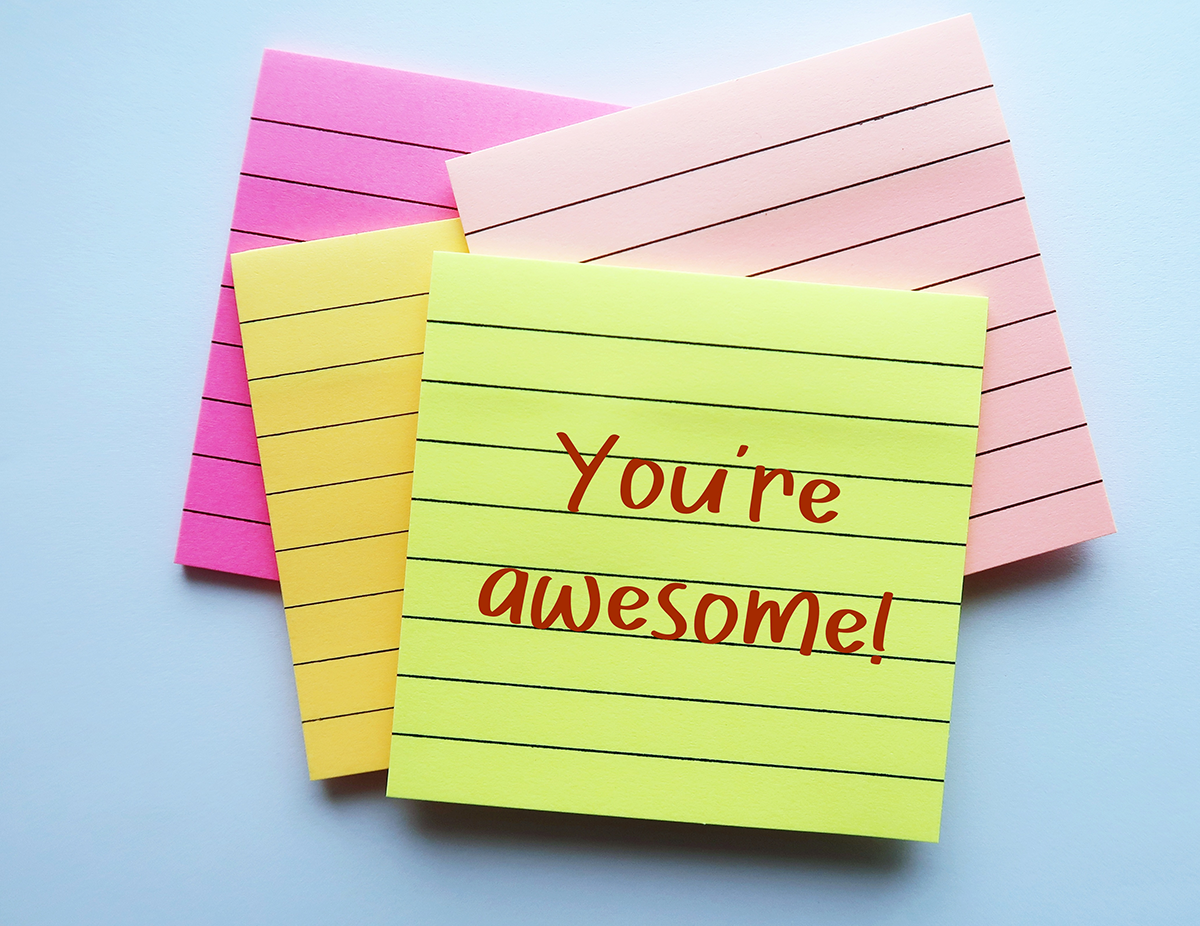 A handwritten note on lined paper that says you're awesome